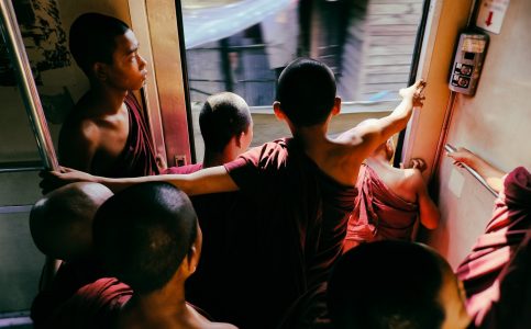 young buddhist monks on a moving train in central myanmar © Hamish Scott-Brown